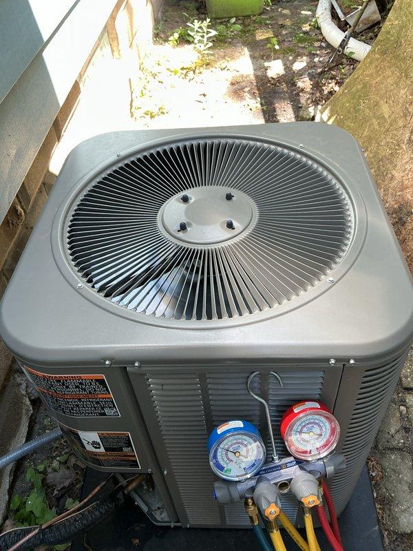 Performed routine Air Care Cooling maintenance on residential outdoor condenser unit. Connected manifold gauge set to service ports to verify system pressures and refrigerant charge levels, confirming unit operating within normal parameters. Inspected condenser coil, fan assembly, and electrical components with no issues identified during this scheduled preventive maintenance visit.