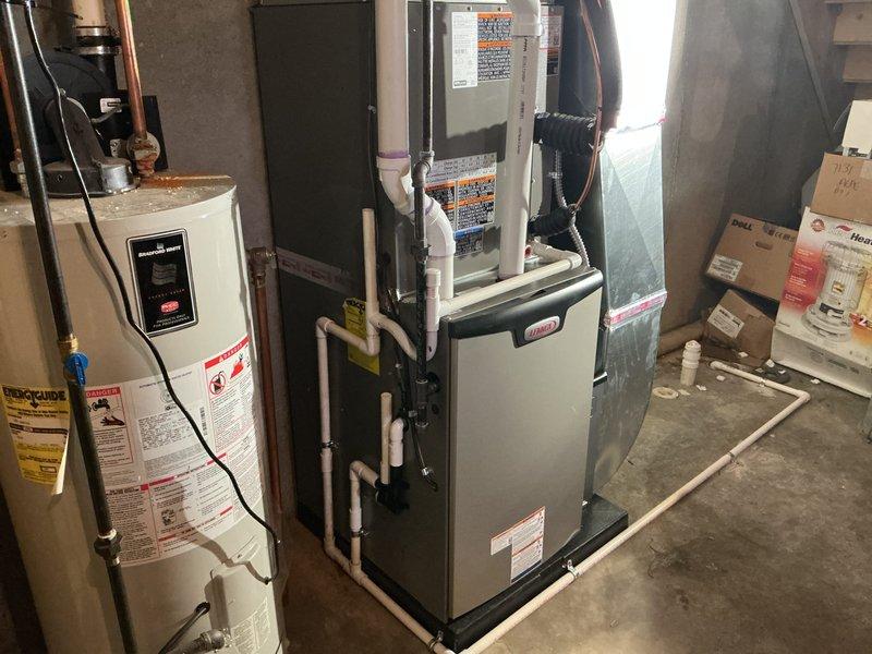 Completed full HVAC system installation in basement mechanical room, including 90,000 BTU furnace and 3-ton air conditioning unit configured for left-side positioning. Installed new air handler with proper refrigerant line connections, condensate drainage system using white PVC piping, and all required electrical connections. All mechanical and electrical permits obtained and system reconnected to existing ductwork per specifications.