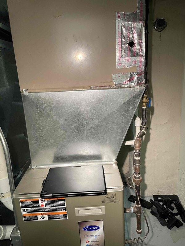 Provided comprehensive estimate for replacement of non-functional Carrier furnace unit located in basement mechanical space. Existing equipment over 10 years old has reached end of service life and requires full system replacement. Assessment included evaluation of current ductwork configuration, existing copper refrigerant lines, electrical connections, and venting requirements to ensure proper sizing and compatibility for new equipment installation.