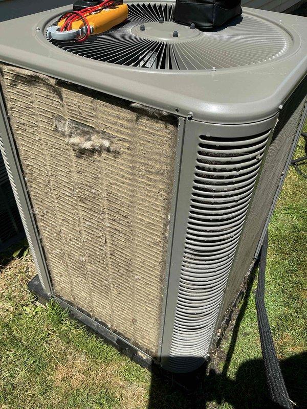 Performed scheduled air conditioning maintenance on outdoor condenser unit. Responded to thermostat error code concern and conducted diagnostic testing using electrical meters to verify system operation and component functionality. Inspected condenser unit which showed significant dirt and debris accumulation on coils and filter screens. Cleaned heavily soiled front panel filters and exterior surfaces to restore proper airflow. Tested capacitor and electrical components to ensure proper voltage and amperage readings. Verified fan motor operation and checked refrigerant pressures. Cleared error code and confirmed thermostat communication with system. Unit restored to normal operating condition with improved airflow efficiency following cleaning and maintenance procedures.
