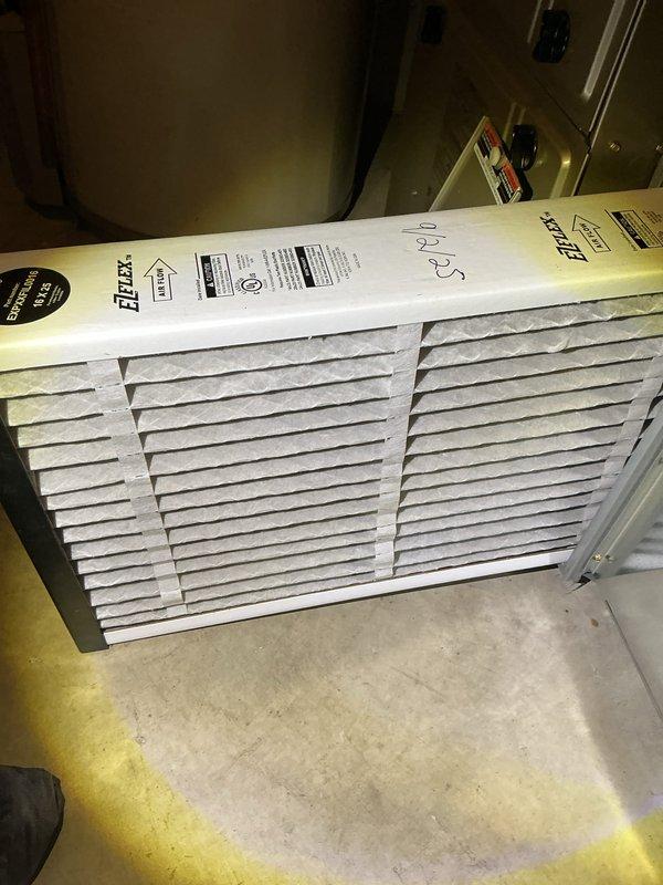 Completed annual cooling maintenance inspection on HVAC system. Observed significant moisture condensation on return air duct surfaces and surrounding panels in attic space, indicating potential humidity issues or inadequate insulation around ductwork. Inspected system components using temperature probes to assess operational parameters. Replaced air filter with new Filtrete unit to maintain proper airflow and system efficiency.