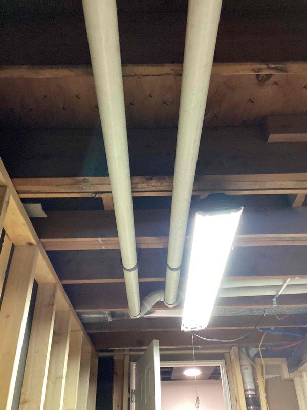 Completed full HVAC system replacement including installation of 70,000 BTU gas furnace, 2-ton air conditioning unit with left-side configuration, and residential water heater in basement utility area. All equipment was properly connected to existing ductwork, plumbing lines, and electrical systems with copper piping, brass fittings, PVC venting, and insulated refrigerant lines installed per manufacturer specifications and local mechanical code requirements.