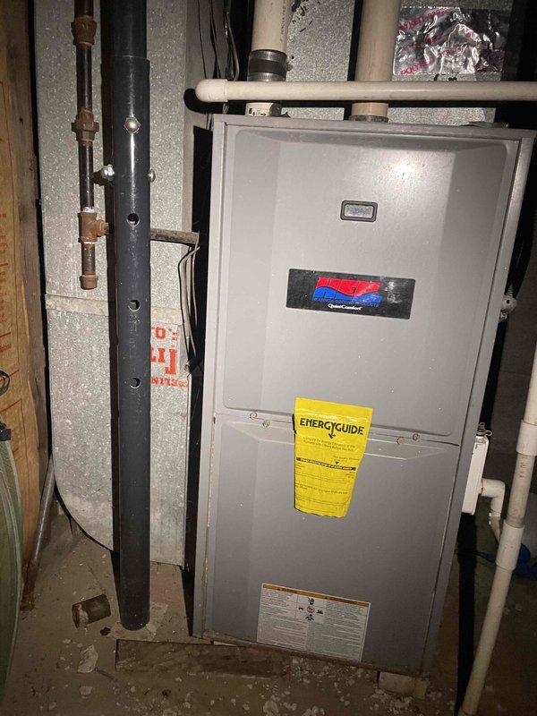 Conducted on-site assessment of existing 23-year-old air conditioning system for full replacement estimate. Evaluated current HVAC equipment configuration in basement utility area, including furnace unit, ductwork, and associated plumbing connections. Documented equipment specifications, installation layout, and mechanical room conditions through photographic documentation. Reviewed system age and discussed replacement options with homeowner, including equipment specifications and available financing programs for new air conditioning system installation.