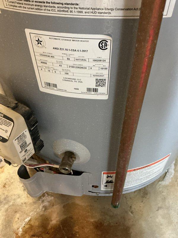 Completed annual cooling maintenance inspection on HVAC system. Unit was found to be operating within normal parameters with no immediate service needs identified. Documented equipment condition with photographic records showing water heater and associated plumbing connections in basement utility area, noting minor floor staining consistent with normal condensate drainage patterns.