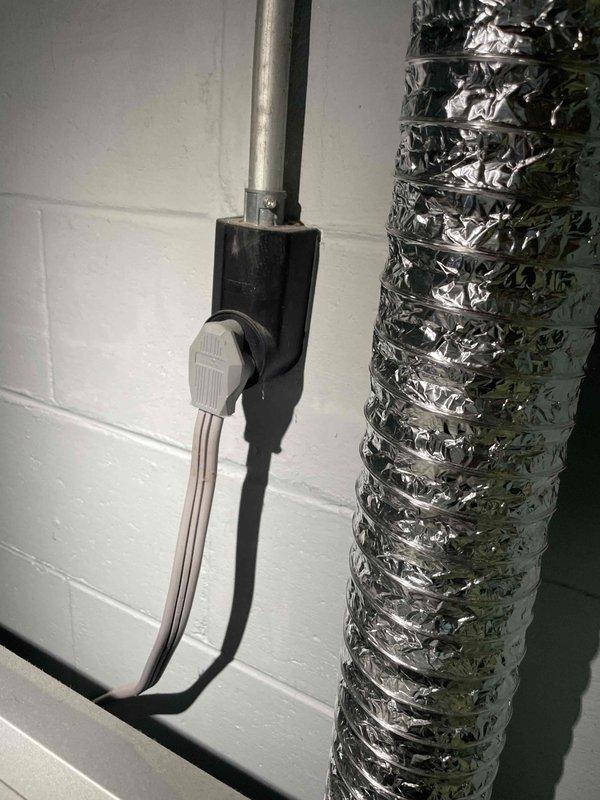 Completed generator sales call and maintenance assessment for existing HVAC system. Inspected flexible aluminum ductwork, electrical conduit connections, and junction box mounting along utility wall. Documented aging water heater with visible rust deterioration and evaluated overall mechanical room conditions including ventilation components and utility equipment placement for future filter and pad replacement recommendations.