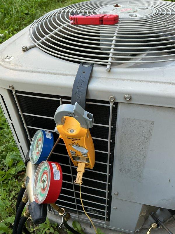 Completed annual cooling maintenance on residential air conditioning system. Performed comprehensive inspection of outdoor condenser unit, checked refrigerant pressures using manifold gauge set, and replaced air filter per scheduled maintenance protocol. Unit operating within normal parameters upon completion of service.