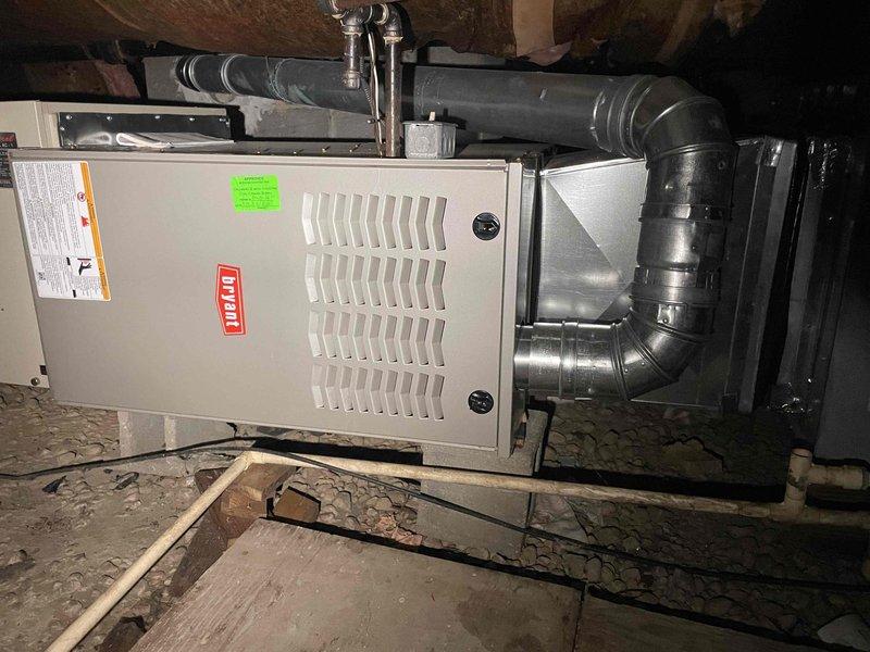 Conducted on-site evaluation for air conditioning replacement at residential property. Existing 30-year-old AC unit is non-operational and requires full replacement. Assessed attic-installed HVAC system including Bryant furnace with associated ductwork and determined air conditioning equipment specifications needed for quote preparation. Documented existing equipment configuration, ductwork connections, and installation conditions through photographic evidence to support replacement estimate.