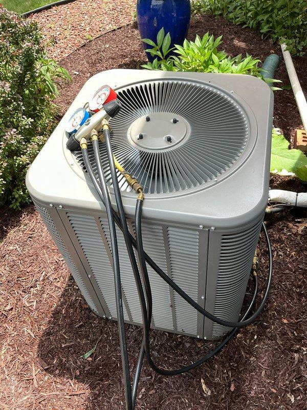Completed annual cooling maintenance on residential air conditioning system. Performed comprehensive inspection of outdoor condenser unit, verified proper operation of compressor and fan motor, checked refrigerant pressures and temperatures using manifold gauges, and confirmed all electrical connections were secure. Replaced furnace filter and documented system condition with photographs showing unit in good working order with no visible defects or concerns.