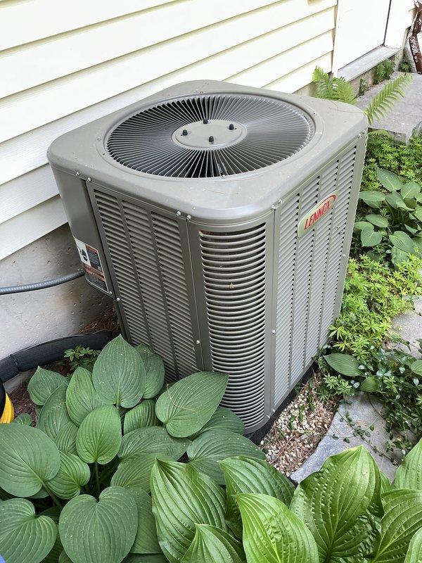 Performed comprehensive annual maintenance on a 6-year-old Lennox air conditioning system. Inspected outdoor condensing unit, verified proper operation of condenser fan motor and compressor, cleaned condenser coils, and checked refrigerant pressures. Tested electrical components including disconnect switch and control circuits, confirmed proper amperage draw on all motors. Inspected and cleared debris from around unit, ensuring adequate airflow through louvers. Verified system cooling performance and found all components operating within manufacturer specifications. No deficiencies identified; system in good working condition for continued service.