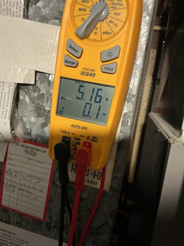 Completed annual cooling maintenance on Lennox air conditioning system. Performed electrical diagnostics using digital multimeter, recording amperage draw of 5.16A on compressor circuit. Removed condenser top panel to inspect internal components, checked condenser coil condition, and verified proper system operation. All measurements within normal operating parameters and unit functioning as designed.