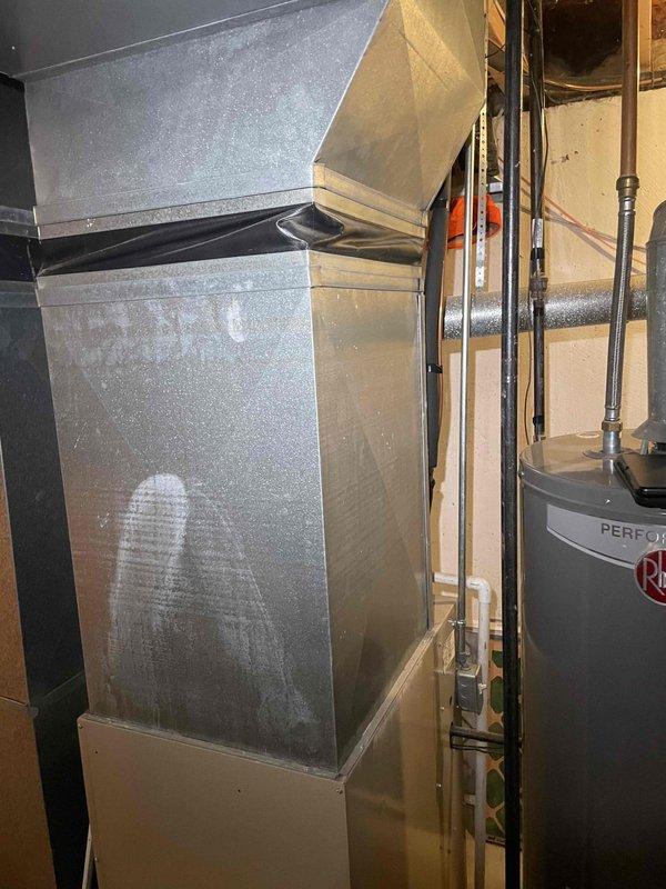 Conducted comprehensive estimate for complete HVAC system replacement in residential property. Evaluated existing 26-year-old furnace showing significant age-related wear and assessed basement mechanical room for equipment replacement feasibility. Documented current system configuration including ductwork with visible condensation issues, existing electrical panel capacity for new equipment installation, and mechanical room layout with water heater and copper piping infrastructure. Provided equipment replacement options for furnace and air conditioning system under promotional offering, discussed installation requirements, and determined timeline for system replacement within customer's requested timeframe.