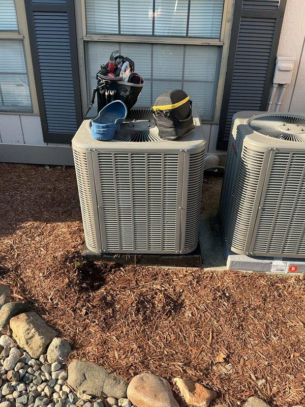 Responded to service call regarding outdoor condenser unit that was reportedly displaced from its original mounting blocks by neighboring HVAC installation crew. Performed thorough inspection of 1-year-old unit to assess potential damage from movement. Examined refrigerant line connections, electrical connections, mounting stability, and cabinet integrity. Verified unit levelness and proper positioning on pad. Documented current condition with photographs showing unit placement and surrounding equipment. Unit found to be operational with both parts and labor warranty active. Completed visual inspection and diagnostic assessment of system components.