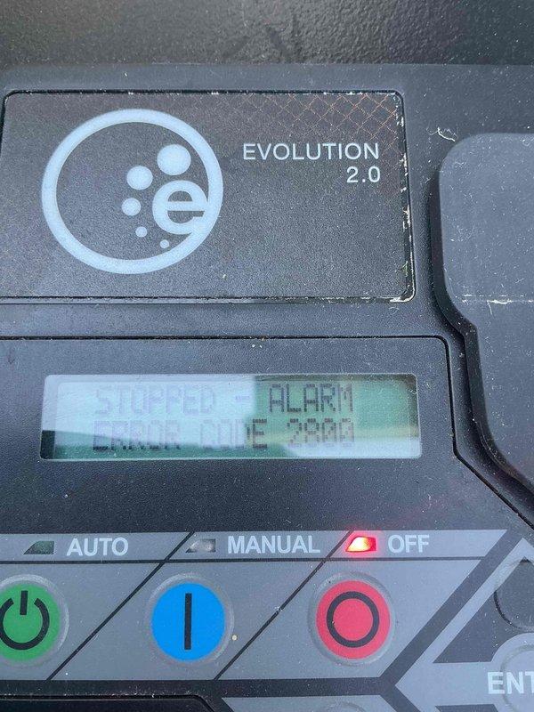 Responded to service call for 14KW Generac Evolution 2.0 generator displaying alarm condition with red indicator light instead of normal green status. Upon arrival, found control panel showing "ALARM" message on display screen with unit in OFF position. Performed diagnostic evaluation of generator system, inspected internal components with housing opened, and documented current operational status. Verified control panel functionality and assessed whether unit successfully completed recent automatic test cycle as scheduled.