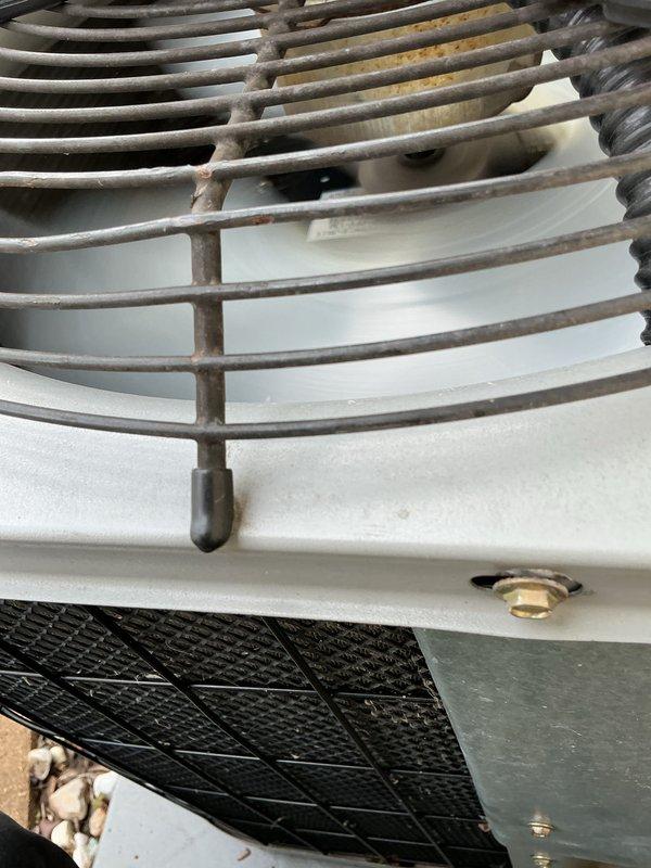 Completed scheduled cooling tune-up on single HVAC unit, performing comprehensive system inspection and maintenance. Serviced condenser unit including fan assembly and motor housing, noting moderate dust and dirt accumulation on wire fan guard which was addressed during maintenance. Verified proper operation of all components, inspected filter media, and checked refrigerant connections and fittings for secure operation.