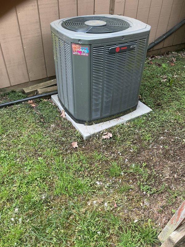 Completed annual cooling maintenance on Trane outdoor condensing unit. Inspected system components, photographed equipment condition, and identified need for air filter/evaporator pad replacement and thermostat service or replacement, with customer approval to proceed with recommended repairs.