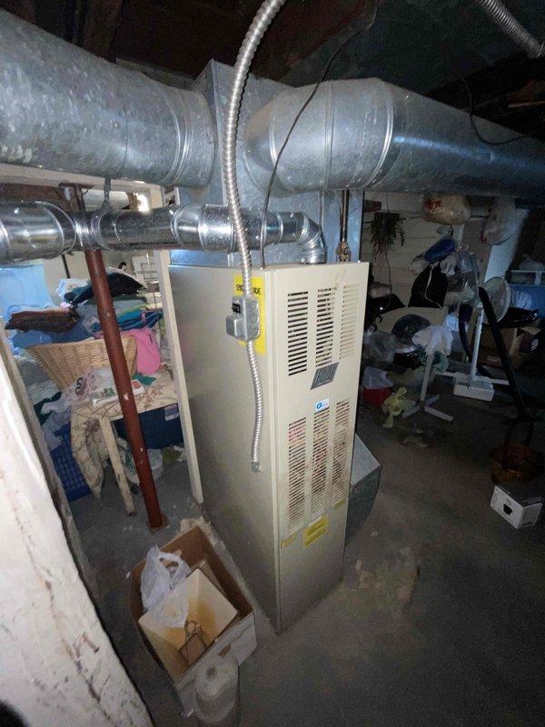Provided comprehensive estimate for replacement of 30+ year old furnace and air conditioning system currently located in basement. Existing natural gas furnace and AC unit are still operational but have exceeded their expected service life. Assessed current HVAC configuration including ductwork layout, venting system, and available space for new equipment installation to develop appropriate replacement recommendations.