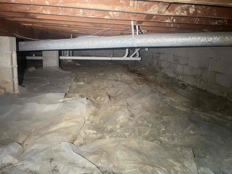 Conducted comprehensive site evaluation for complete HVAC system replacement at owner-occupied residence. Assessed existing 25-year-old furnace for replacement and evaluated property for new central air conditioning installation where no AC system currently exists. Inspected crawl space conditions, including vapor barrier integrity, foundation walls, and available space for ductwork routing and equipment placement. Documented existing plumbing infrastructure and floor joist configuration to determine optimal equipment positioning and clearance requirements. Evaluated exterior foundation areas and basement window well accessibility for potential condenser unit placement and refrigerant line routing. Provided detailed estimate for full system upgrade including new furnace and central air conditioning installation to modernize heating and cooling capabilities.