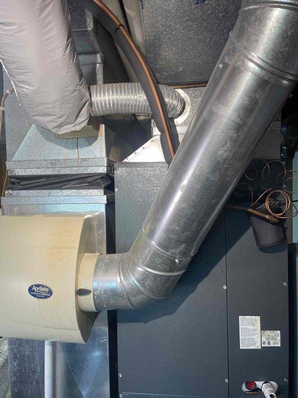Conducted on-site assessment for furnace and air conditioning replacement at owner-occupied residential property. Evaluated existing HVAC system including air handler, ductwork configuration, humidification equipment, and electrical service panel to determine replacement specifications. Documented current system components including Aprilaire humidifier integration, metal supply ductwork, flexible insulated ducting, refrigerant lines, and electrical connections. Assessed electrical panel capacity and circuit availability to support new equipment installation. Prepared comprehensive replacement estimate for complete furnace and AC unit system.