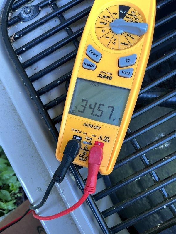 Completed comprehensive A/C tune-up on 13-year-old system. Performed visual inspection of evaporator coil, noting frost accumulation on refrigerant lines indicating proper cooling cycle operation. Verified electrical performance at outdoor condensing unit with multimeter readings confirming adequate voltage supply at 345.7 volts. All system components operating within normal parameters at time of service completion.
