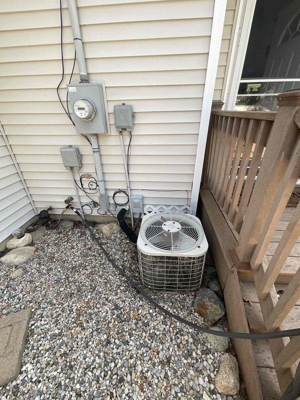 Assessed 28-year-old residential air conditioning system with severely diminished cooling capacity, running continuously but only reducing indoor temperature by one degree over eight hours with discharge air barely below ambient room temperature. Documented existing outdoor condenser unit showing significant age-related deterioration and weathering, with refrigerant lines and electrical connections intact. Provided replacement estimate for complete system due to age and inefficient operation beyond economical repair.