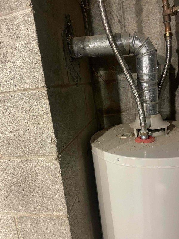 Provided comprehensive HVAC estimate for complete system replacement of 20+ year old non-operational natural gas forced air furnace and air conditioning system in colonial residence. Documented existing electrical panel configuration and utility room conditions, including water heater placement and plumbing infrastructure, to assess installation requirements and ensure proper system integration with home's existing electrical and mechanical systems.
