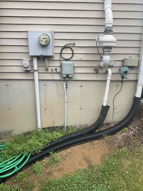 Conducted site assessment for whole home Kohler generator installation at manufactured residence. Evaluated existing electrical service panel, meter location, and utility connections mounted on exterior wall. Identified suitable installation location on side yard area near existing HVAC equipment with adequate clearance from structure and accessibility for fuel supply connection and maintenance access.