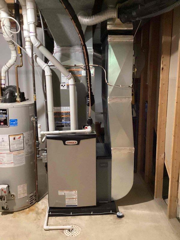 Completed full HVAC system installation including a Lennox 90,000 BTU furnace and 3.5-ton air conditioning unit with right-side configuration. Installed all necessary ductwork, refrigerant lines, condensate drainage, and electrical connections in basement mechanical room. Mounted outdoor condensing unit on exterior with proper refrigerant line routing through foundation, installed PVC venting through exterior wall, and completed all required reconnections. Obtained mechanical and electrical permits prior to installation and ensured all work met code requirements for complete system operation.