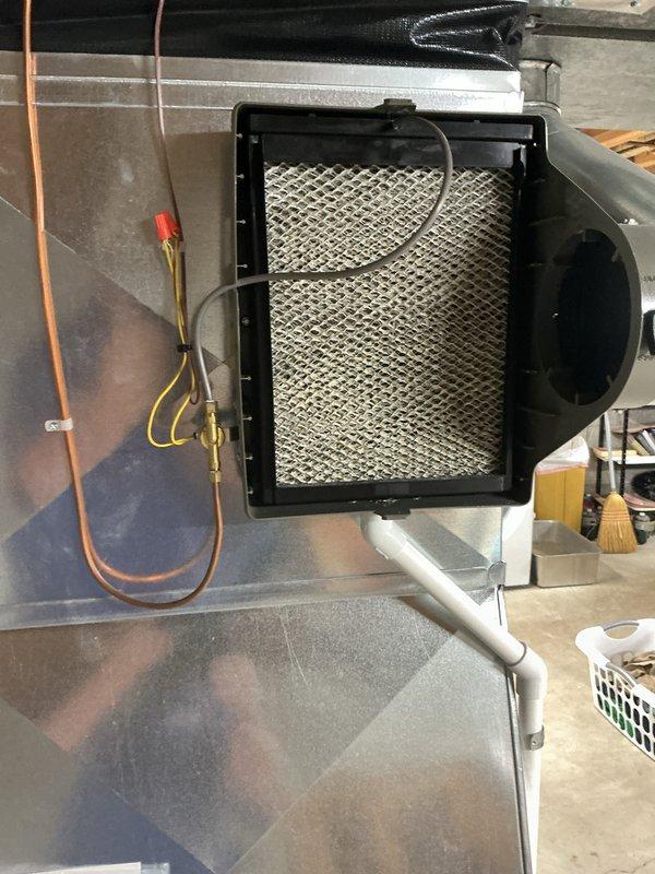 Completed annual cooling maintenance on residential HVAC system. Replaced air filter and evaporator pad as scheduled, inspected refrigerant lines and connections for leaks, verified proper operation of all system components including blower assembly and ductwork connections.
