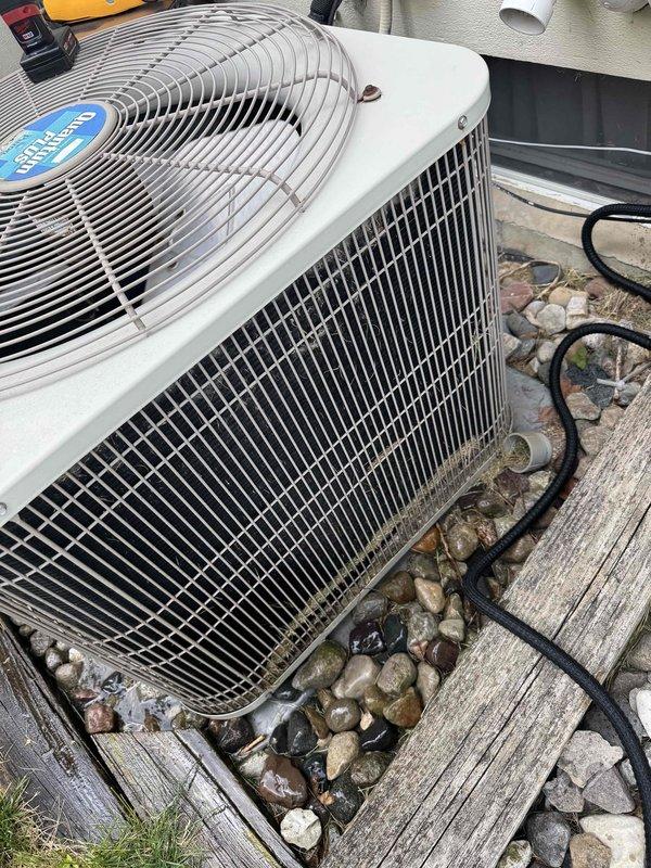 Completed annual cooling maintenance on Bryant residential condensing unit. Performed comprehensive inspection of outdoor unit including fan motor operation, refrigerant line connections, electrical components, and condenser coil condition. Verified proper airflow through protective wire guard and cleaned debris from surrounding area. Unit operating within normal parameters with no deficiencies noted during routine ACM service.