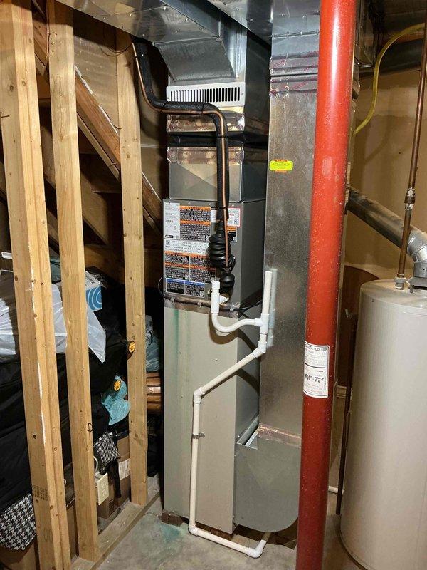 Completed installation of 1.5-ton air conditioning system with evaporator coil at rear location of property. Performed mechanical reconnection of A/C unit to existing infrastructure, integrated new coil assembly with ductwork, and established all refrigerant line connections and electrical hookups. All equipment tested and verified operational upon completion.
