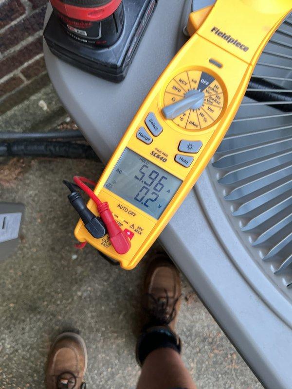 Completed comprehensive AC tune-up and maintenance on 10-year-old system. Performed electrical diagnostics using multimeter, recording voltage readings of 596V and 0.2V at outdoor unit, along with capacitance measurement of 45.47 MFD to verify proper component operation. System inspected and found operating within normal parameters with no deficiencies noted.