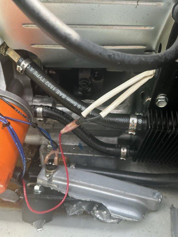 Performed diagnostic evaluation on 18KW Generac generator with reported engine failure. Upon inspection, confirmed catastrophic engine damage requiring complete engine replacement. Documented internal component condition with photographs showing compromised mechanical assembly, hose connections, and associated hardware for warranty and repair assessment purposes.