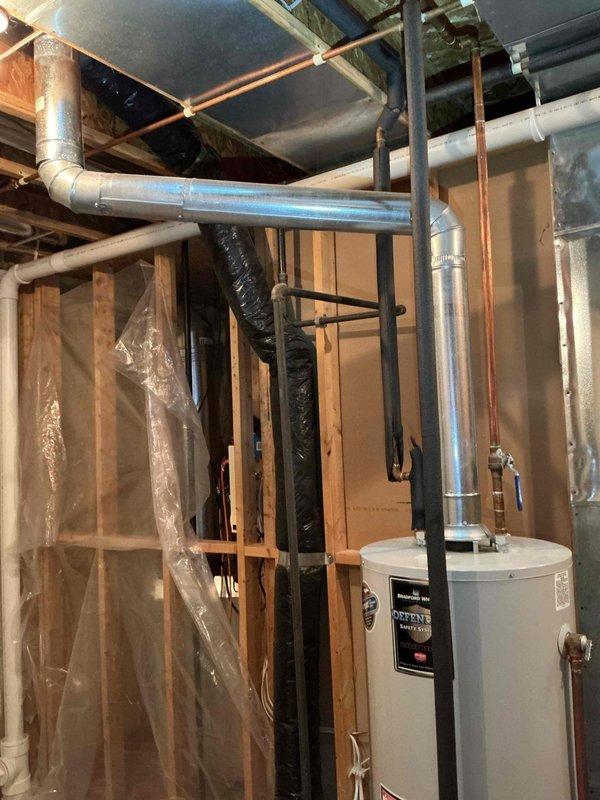 Completed scheduled Air Care Maintenance (ACM) service including system inspection, filter replacement, and photographic documentation of mechanical equipment and plumbing connections in utility area. All HVAC components inspected and found operational with routine maintenance tasks performed according to recurring service protocol.
