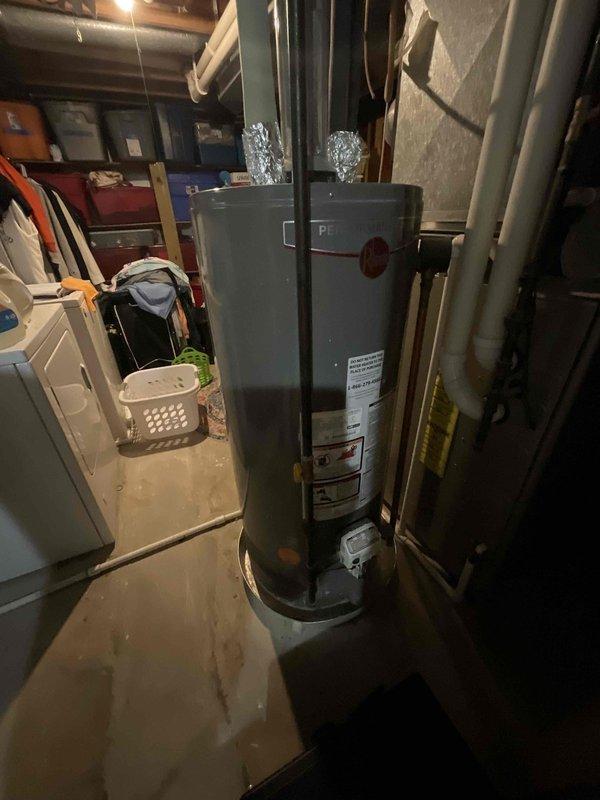 Provided comprehensive estimate for complete HVAC system replacement including new air conditioning unit and natural gas furnace to replace 30-year-old non-operational equipment. Assessed existing basement furnace installation and outdoor AC unit location, documented current system configuration with water heater proximity and exterior condensing unit placement on concrete patio adjacent to house siding. Evaluated ductwork connections, venting requirements, and utility access points to prepare detailed replacement proposal for new high-efficiency heating and cooling system.