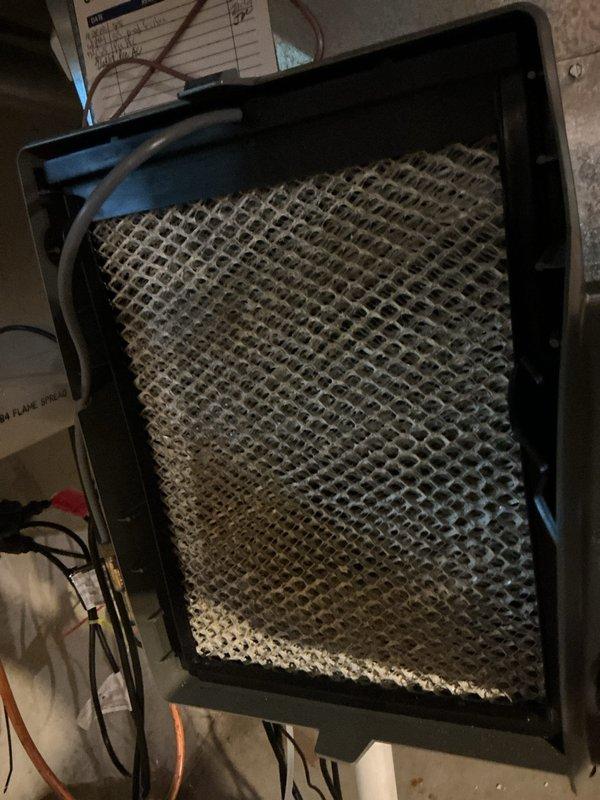 Completed annual cooling maintenance inspection on HVAC system. Identified and documented heavily soiled mesh filter with significant dust and debris accumulation requiring replacement. Installed new HCF20-11 MERV 11 pleated air filter to restore proper airflow and system efficiency.
