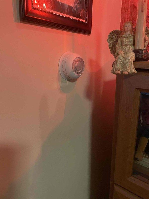 Conducted on-site assessment for ductless mini split cooling system installation in residence with no existing cooling equipment. Evaluated interior living space with existing thermostat location and inspected basement mechanical room containing exposed ductwork, aged brick walls, and existing HVAC cabinet to determine optimal placement for indoor and outdoor units and establish routing for refrigerant lines and electrical connections.