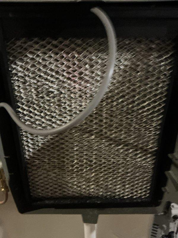 Completed annual air conditioning maintenance service including inspection of evaporator coil assembly and replacement of air filter. System inspected, refrigerant lines checked for proper connection, and new pleated filter installed to ensure optimal airflow and efficiency.