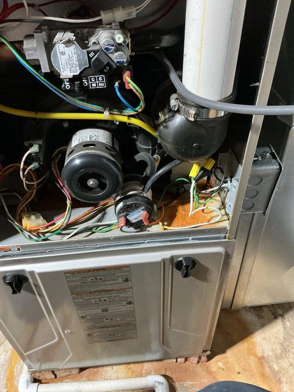 Completed annual HVAC maintenance inspection on residential furnace system. Removed access panels to inspect internal components including blower motor assembly, gas valve, electrical connections, and wiring harness. Replaced furnace filters and verified all mechanical and electrical components were functioning properly. All safety controls, wire connections, and gas supply lines were inspected and found to be secure with no visible defects or concerns noted.