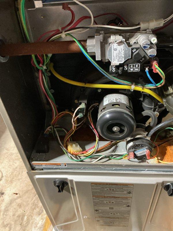 Completed annual HVAC maintenance inspection on residential furnace system. Removed access panels to inspect internal components including blower motor assembly, gas valve, electrical connections, and wiring harness. Replaced furnace filters and verified all mechanical and electrical components were functioning properly. All safety controls, wire connections, and gas supply lines were inspected and found to be secure with no visible defects or concerns noted.