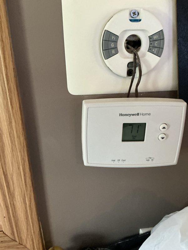 Completed scheduled air conditioning maintenance on DGAA070BDTB unit located in mechanical room. Performed comprehensive system inspection, verified thermostat operation displaying 71°F, checked all electrical connections and wiring, and documented equipment condition with photos for service records.