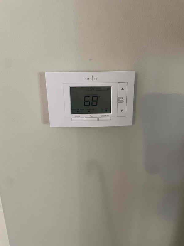 Completed full HVAC system installation including a Lennox 70,000 BTU furnace and 2-ton air conditioning unit with right-side placement. Installed new Sensi programmable thermostat, ran new electrical circuit to support equipment, and connected all ductwork and refrigerant lines. All mechanical and electrical permits were obtained prior to installation, system was tested and confirmed operational upon completion.