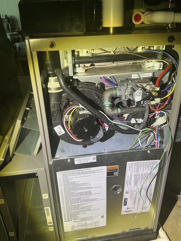 Completed annual HVAC maintenance on residential furnace system. Accessed and inspected internal components including blower motor assembly, gas lines, control boards, and electrical connections. Inspected high-efficiency filter and evaporator coil pad for proper airflow and cleanliness. All safety controls, circuit boards, and wiring connections verified to be in normal operating condition with no deficiencies noted.