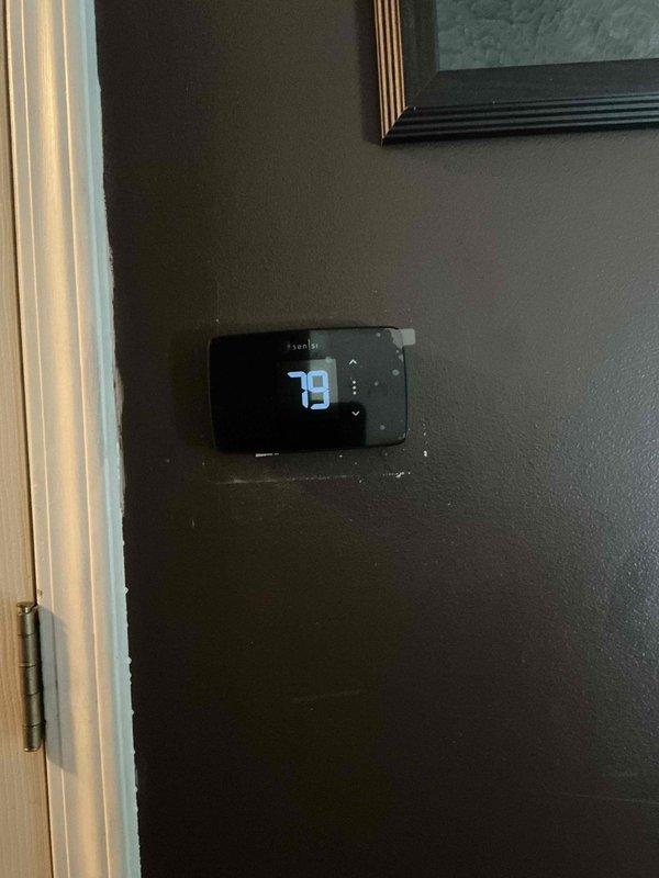 Completed installation of customer-provided thermostat at residential property. Customer contacted to proceed with previously provided estimate for thermostat installation. Successfully installed and configured new Sensi digital thermostat on interior wall, replacing existing unit. Verified proper wiring connections, tested heating and cooling functions, and confirmed accurate temperature readings and system response. Payment collected upon completion.