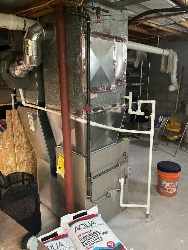 Completed annual cooling maintenance on residential HVAC system. Inspected furnace unit, ductwork, and all associated components in basement mechanical room. Examined air filter which showed moderate dust accumulation consistent with normal usage, and verified proper installation within metal frame housing. All equipment operating within normal parameters with no deficiencies noted during inspection.