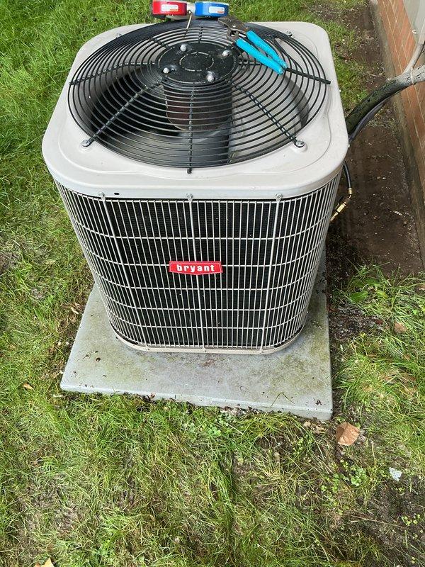 Completed annual cooling maintenance on residential air conditioning condenser unit. Connected manifold gauge set to measure refrigerant pressures and verify system operating parameters within manufacturer specifications. Inspected condenser coil, fan motor assembly, electrical connections, and refrigerant lines for proper operation and condition. Unit found to be functioning properly with no deficiencies noted at time of service.