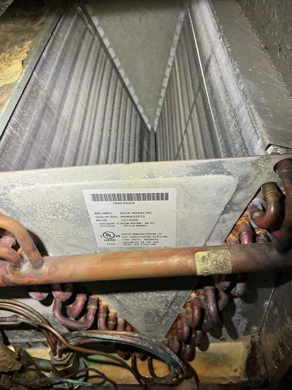 Performed comprehensive air conditioning maintenance tune-up on residential split system. Inspected evaporator coil assembly in attic space, verifying proper fin condition and refrigerant line connections. Evaluated outdoor condenser unit, checking fan operation, electrical connections, and overall system performance. All components found operating within normal parameters with no deficiencies noted during inspection.