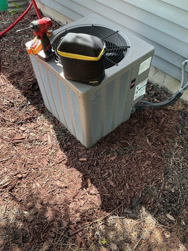 Performed comprehensive air conditioning maintenance tune-up on residential split system. Inspected evaporator coil assembly in attic space, verifying proper fin condition and refrigerant line connections. Evaluated outdoor condenser unit, checking fan operation, electrical connections, and overall system performance. All components found operating within normal parameters with no deficiencies noted during inspection.