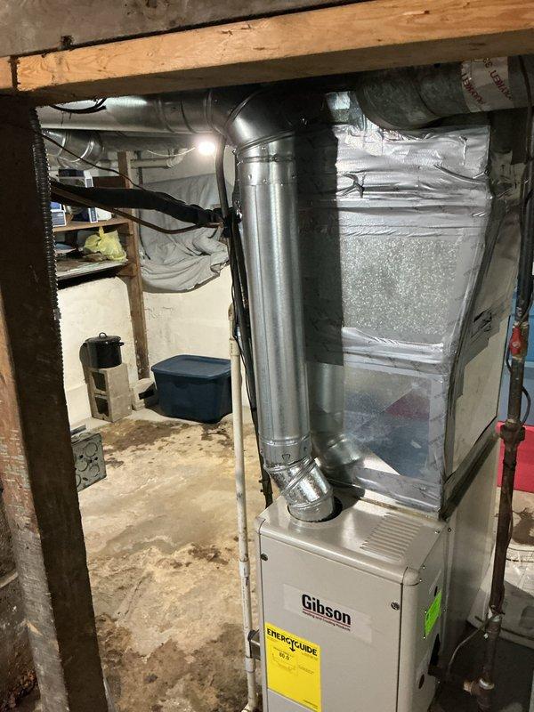 Responded to service call for air conditioning system with reported performance issues on 6-year-old unit. Upon arrival, performed comprehensive system evaluation including inspection of indoor air handler and associated ductwork in basement mechanical room. Verified Gibson furnace and air handler operation, checked refrigerant line connections and insulation integrity on copper piping. Inspected duct connections, metallic ductwork, and flexible duct joints for proper sealing and airflow restrictions. Examined system components for proper operation and potential efficiency losses. System found operating within normal parameters with no immediate mechanical failures identified. Provided recommendations for routine maintenance to optimize performance.