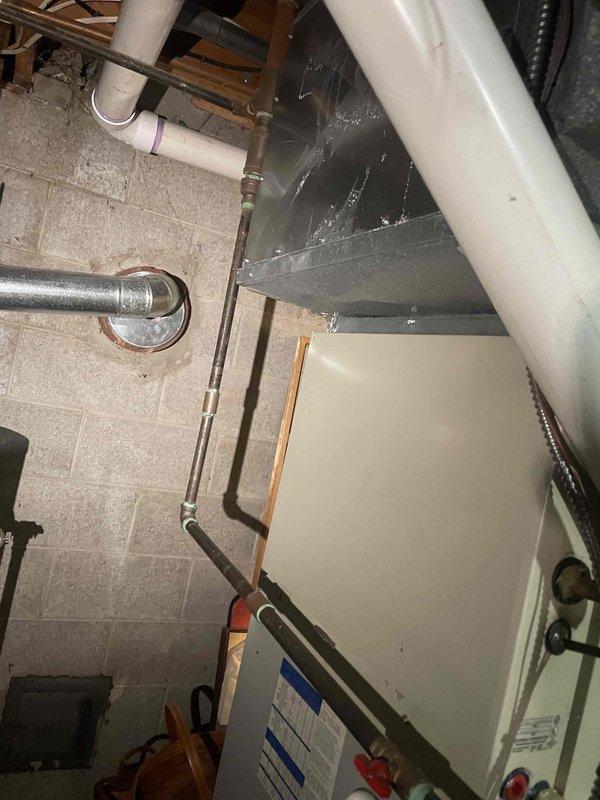 Provided estimate for air conditioning system replacement in basement location. Current 35-year-old unit is operational but has reached end of expected service life. Assessed existing HVAC infrastructure including Trane furnace, ductwork configuration, and mechanical room layout to determine replacement specifications and installation requirements.
