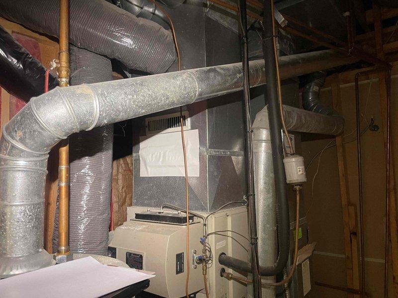 Conducted on-site evaluation for air conditioning system replacement. Assessed existing HVAC equipment in mechanical room, including furnace/air handler unit, ductwork configuration, copper refrigerant lines, and electrical service panel. Documented current system conditions through photographic inspection to provide accurate replacement estimate for expedited installation timeline.